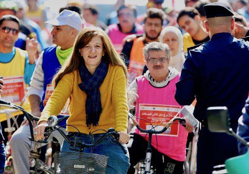 (190216) -- BAGHDAD, Feb. 16, 2019 (Xinhua) -- Iraqis participate in a cycling event in Baghdad, Iraq, on Feb. 16, 2019. After decades of war and conflicts that tarnished the Iraqi streets, Iraqis held a rare cycling event on Saturday, reflecting the revival of life in the once war-torn city. Many women participated in the event for the first time in an attempt to combat sexism and challenge the traditional norms that prevent Iraqi women from riding bicycles in public. (Xinhua\/Khalil Dawood)