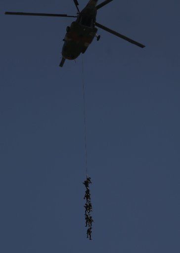 (190304) -- KATHMANDU, March 4, 2019 (Xinhua) -- Nepalese army personnel demonstrate a rescue operation during the Army Day celebration in Kathmandu, Nepal, March 4, 2019. (Xinhua\/Sunil Sharma)
