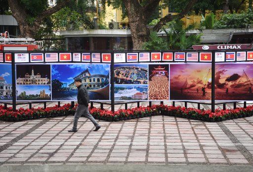 (190225) -- HANOI, Feb. 25, 2019 (Xinhua) -- A man walks past posters of the media center of the DPRK-USA summit in Hanoi, Vietnam, on Feb. 25, 2019. The second summit between top leader of the Democratic People\