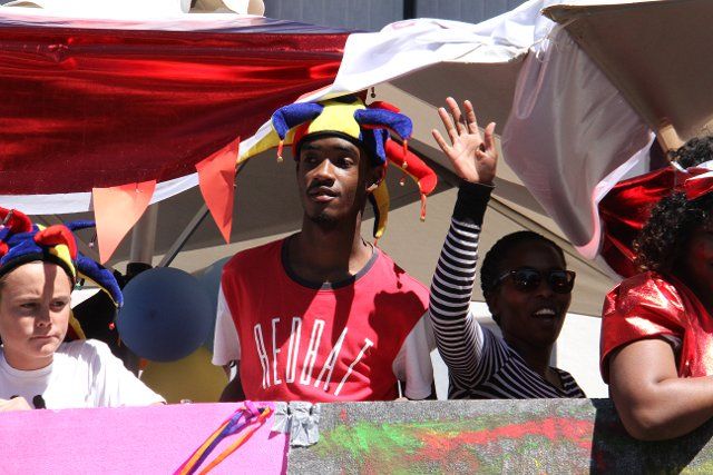 (190407) -- WINDHOEK, April 7, 2019 (Xinhua) -- People gesture during a Windhoek Carnival parade in Windhoek, capital of Namibia, April 6, 2019. Windhoek Carnival (WIKA) started in 1952, featuring music performances and dance, a masked ball and street parades with floats in a revelry. It lasts over two weeks from early April every year. (Xinhua\/Sun Yin