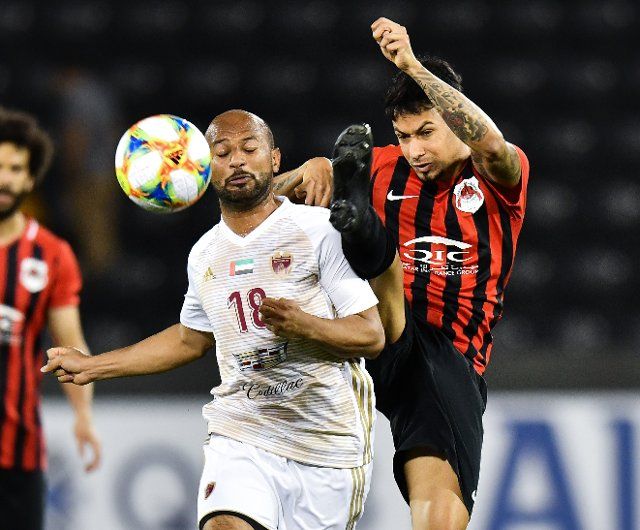 (190410) -- DOHA, April 10, 2019 (Xinhua) -- Ahmed Ali (L) of Al Wahda FSCC vies with Lucca of Al Rayyan SC during the AFC Asian Champions League group B match between Qatar\