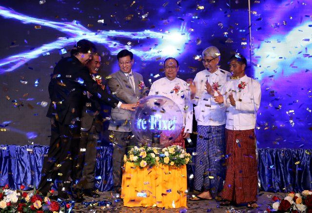 (190331) -- YANGON, March 31, 2019 (Xinhua) -- Guests press bottom during the opening and handover ceremony of the Offshore Fixed Pilot Station in Yangon, Myanmar, March 30, 2019. The Offshore Fixed Pilot Station, built by a Chinese engineering company, opened on Saturday. (Xinhua\/Haymhan Aung