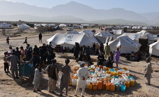 (190404) -- BALKH, April 4, 2019 (Xinhua) -- Displaced people receive water at a makeshift camp in Mazar-i-Sharif, capital of Balkh province, Afghanistan, April 4, 2019. More than 42,000 Afghans have been displaced following flooding in the country within the past one month and most needs supplies, the UN Office for the Coordination of Humanitarian Affairs (OCHA) reported on Wednesday. (Xinhua\/Kawa Basharat