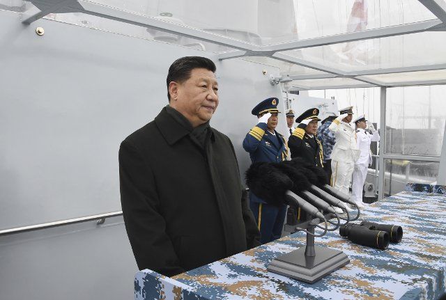 (190423) -- QINGDAO, April 23, 2019 (Xinhua) -- Chinese President Xi Jinping, also general secretary of the Communist Party of China Central Committee and chairman of the Central Military Commission, reviews a multinational fleet during a naval parade held in Qingdao, east China\