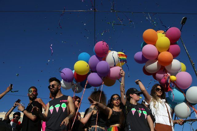 (190608) -- ATHENS, June 8, 2019 (Xinhua) -- People dance in front of the parliament building during the pride parade in Athens, Greece, on June 8, 2019. Thousands of members of the lesbian, gay, bisexual, transgender, queer and intersex community (LGBTQI) of Greece paraded in Athens to celebrate diversity on Saturday. (Xinhua\/Marios Lolos