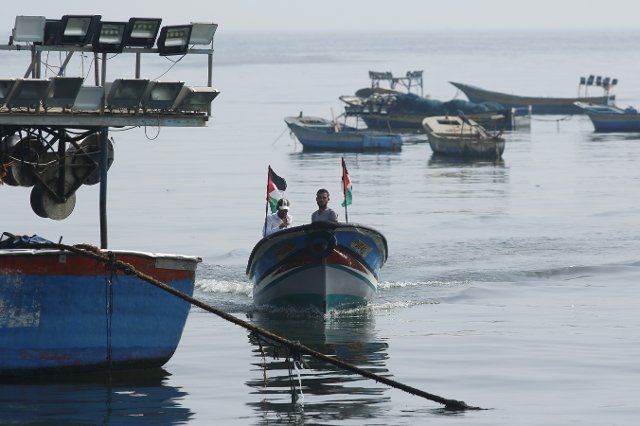 (190614) -- GAZA, June 14, 2019 (Xinhua) -- Palestinian fishermen go fishing on their boat at a seaport in Gaza, June 12, 2019. Israel announced on Wednesday night it has imposed a naval blockade on the Gaza Strip after helium-filled incendiary balloons were launched from the coastal enclave. Earlier on Wednesday, helium-filled balloons from Gaza caused eight fires in southern Israel\