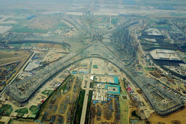 (190630) -- BEIJING, June 30, 2019 (Xinhua) -- Aerial photo taken on June 30, 2017 shows the terminal of the Beijing new airport under construction in the southern Daxing District of Beijing, capital of China. The steel racking of the terminal was completed at that time. June 30 marks the end of the new airport infrastructure construction and the start of the preparatory stage of the airport\
