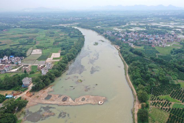 (190701) -- NANNING, July 1, 2019 (Xinhua) -- Aerial photo taken on June 29, 2019 shows a bridge under construction near a historical site of the 1934 Battle of Xiangjiang in Quanzhou County, south China\