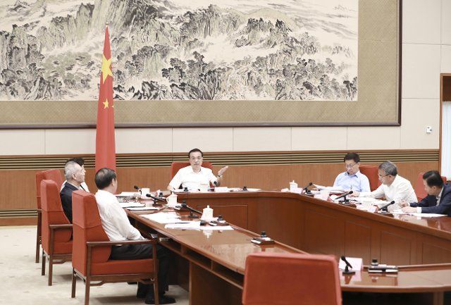 (190711) -- BEIJING, July 11, 2019 (Xinhua) -- Chinese Premier Li Keqiang, also a member of the Standing Committee of the Political Bureau of the Communist Party of China (CPC) Central Committee and the head of the leading group of climate change, energy saving and emission reduction, presides over a meeting in Beijing, capital of China. China will continue efforts to tackle climate change and plans to introduce more measures to strengthen energy saving and emission reduction, according to Li. Vice Premier Han Zheng, also a member of the Standing Committee of the Political Bureau of the CPC Central Committee and vice head of the leading group of climate change, energy saving and emission reduction, also attended the meeting. (Xinhua\/Pang Xinglei)