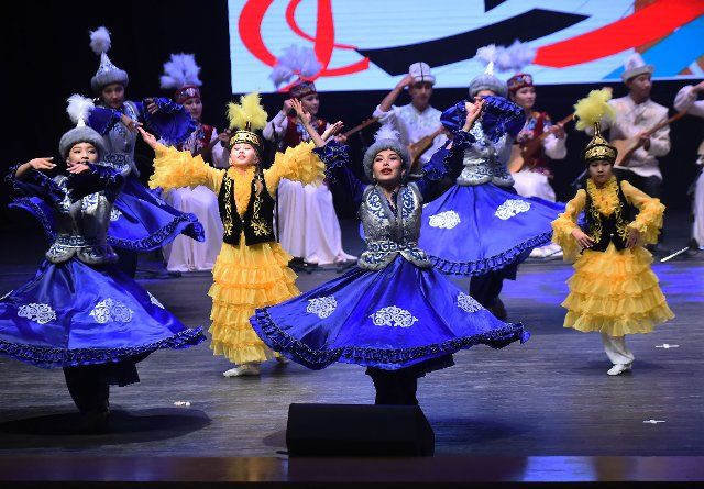 (190702) -- HAWALLI GOVERNORATE (KUWAIT), July 2, 2019 (Xinhua) -- Artists from Kyrgyzstan perform during a cultural show in Hawalli Governorate, Kuwait, on July 2, 2019. A cultural festival for children and young people is held in Kuwait from June 27 to July 18. The festival features a number of cultural activities, including musicals and theater performances. (Xinhua\/Asad)