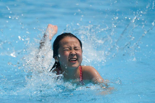 (190726) -- HANGZHOU, July 26, 2019 (Xinhua) -- A child plays at a water park in Houxi Village of Hecun Township, Tonglu County, east China\