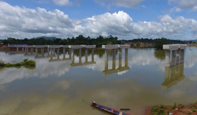 (190821) -- VIENTIANE, Aug. 21, 2019 (Xinhua) -- Photo taken on Aug. 19, 2019 shows the construction site of the Vientiane to Vangvieng section of China-Laos expressway in Laos. China-Laos expressway is co-developed by China Yunnan Construction and Investment Holding Group (YCIH) Co., Ltd. and the Lao Ministry of Planning and Investment. The under-construction Vientiane to Vangvieng section stretches 109.1 kilometers and will save the tour from Vientiane to Vangvieng from 4 hours to 1.5 hours on drive. (Photo by Liu Ailun\/Xinhua