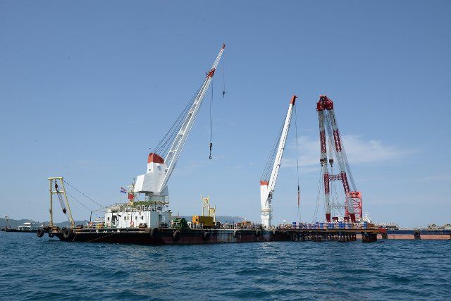(190816) -- PELJESAC PENINSULA (CROATIA), Aug. 16, 2019 (Xinhua) -- Photo taken on Aug. 7, 2019 shows the construction site of the Peljesac Bridge near the Peljesac Peninsula, Croatia. A Chinese consortium led by China Road and Bridge Corporation (CRBC) won the bid to build the first phase of the Peljesac Bridge and its access roads early last year. The 2.4km-long cable-stayed bridge will connect the southern tip of the Croatian mainland to the Peljesac Peninsula, thus bypassing a short strip of Bosnian and Herzegovina\