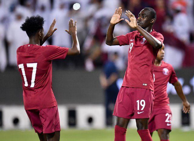 (190906) -- DOHA, Sept. 6, 2019 (Xinhua) -- Almoez Ali Abdulla (R) of Qatar celebrates with teammate during the FIFA World Cup Qatar 2022 and AFC Asian Cup China 2023 Preliminary Joint Qualification second round Group E football match between Qatar and Afghanistan in Doha, Qatar, on Sept. 5, 2019. (Photo by Nikku\/Xinhua)