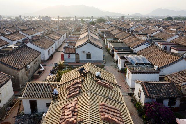 (191115) -- LONGHAI, Nov. 15, 2019 (Xinhua) -- Aerial photo taken on Nov. 14, 2019 shows villagers repairing a residential house at Daimei Village in Longhai City, southeast China\