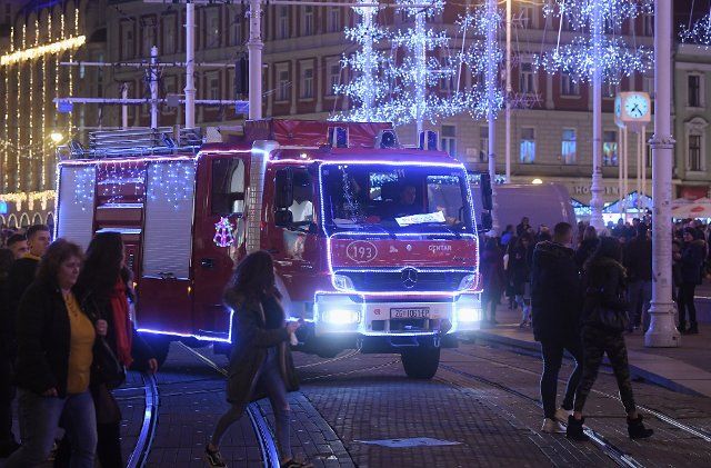 (191221) -- ZAGREB, Dec. 21, 2019 (Xinhua) -- A fire engine decorated with Christmas lights is seen in Zagreb, Croatia, Dec. 20, 2019. Firefighters came up with the idea of decorating the fire engine to warn people of safety issues related to Christmas decorations and fireworks. (Marko Lukunic\/Pixsell via Xinhua