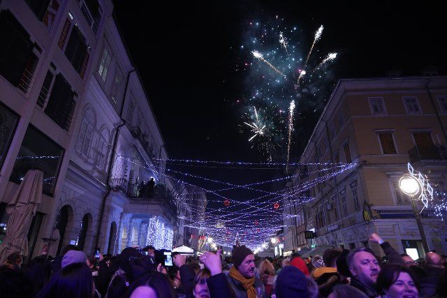 (200101) -- RIJEKA, Jan. 1, 2020 (Xinhua) -- People celebrate the New Year on the Promenade of Rijeka, Croatia, Jan. 1, 2020. (Nel Pavletic\/Pixsell via Xinhua