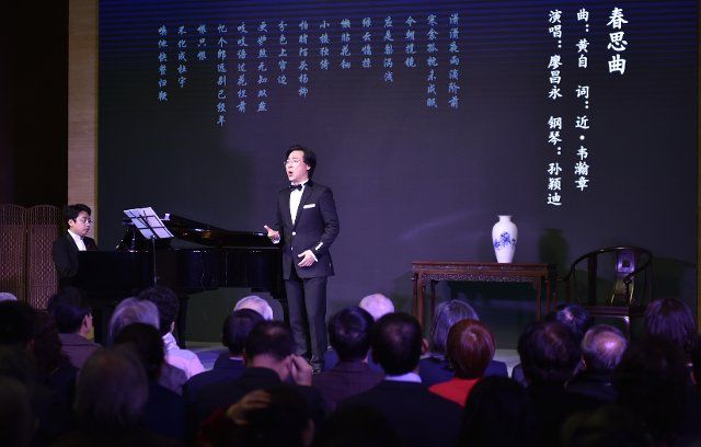 (191210) -- BEIJING, Dec. 10, 2019 (Xinhua) -- Liao Changyong, a famous baritone singer, sings at his solo concert in the National Art Museum of China (NAMOC) in Beijing, capital of China, Dec. 10, 2019. (Xinhua\/Lu Peng)