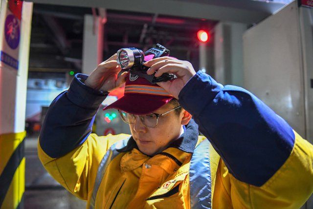 (200110) -- CHANGCHUN, Jan. 10, 2020 (Xinhua) -- Tian Jinsheng, a mechanical engineer of the Changchun section of China Railway Shenyang Group Co., Ltd., prepares to work in Changchun, northeast China\