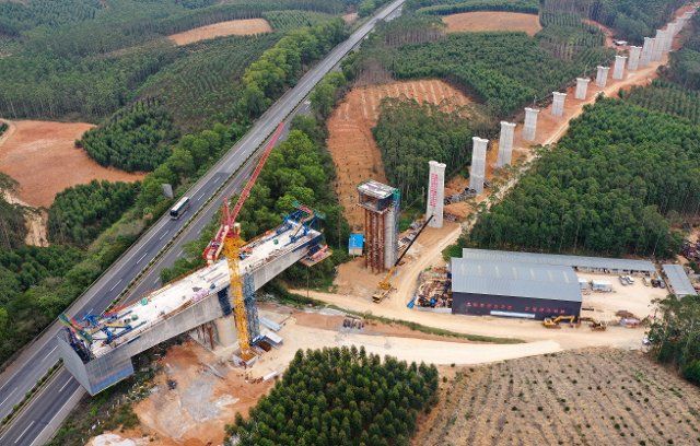 (200225) -- NANNING, Feb. 25, 2020 (Xinhua) -- Aerial photo shows a bridge under construction of Nanning-Chongzuo railway in south China\