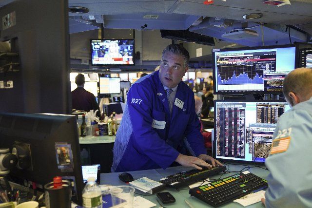 (200228) -- NEW YORK, Feb. 28, 2020 (Xinhua) -- Traders work at New York Stock Exchange in New York, the United States, on Feb. 28, 2020. U.S. stocks ended mixed on Friday. The Dow was down 1.39 percent to 25,409.36, the S&P 500 fell 0.82 percent to 2,954.22, and the Nasdaq was up 0.01 percent to 8,567.37. (Xinhua\/Wang Ying)