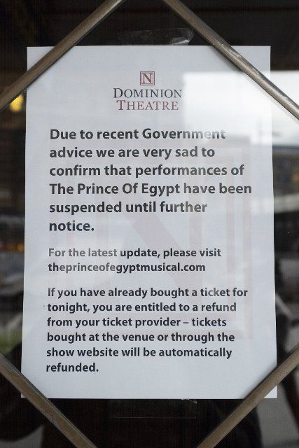 (200318) -- LONDON, March 18, 2020 (Xinhua) -- A notice is seen at an entrance to a theatre in West End in London, Britain, on March 17, 2020. As many as 1,950 people have tested positive for COVID-19 in Britain as of Tuesday morning, according to the latest figure from the Department of Health and Social Care. Following intensive review, the British government has stepped up measures to fight COVID-19. British Prime Minister Boris Johnson on Monday called on people to stop non-essential contact with others and to stop all unnecessary travel. (Photo by Ray Tang\/Xinhua)