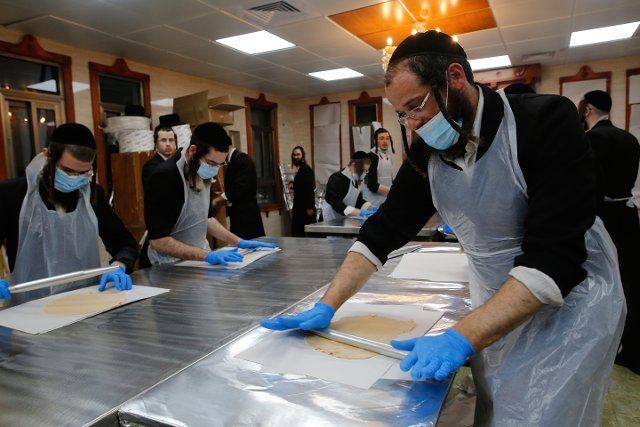 (200327) -- RECHOVOT, March 27, 2020 (Xinhua) -- Ultra-Orthodox Jews prepare matza (unleavened bread) for the upcoming Jewish holiday of Passover at a bakery in the central Israeli city of Rechovot on March 26, 2020. (Photo by Gil Cohen Magen\/Xinhua)