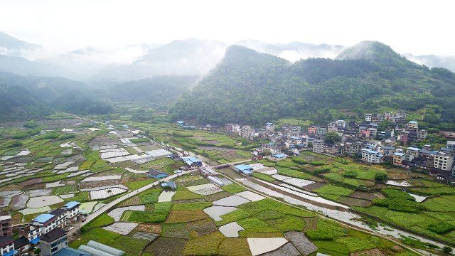 (200329) -- QIANDONGNAN, March 29, 2020 (Xinhua) -- Aerial photo taken on March 29, 2020 shows spring scenery after rainfall in Laquan Village of Congjiang County, southwest China\
