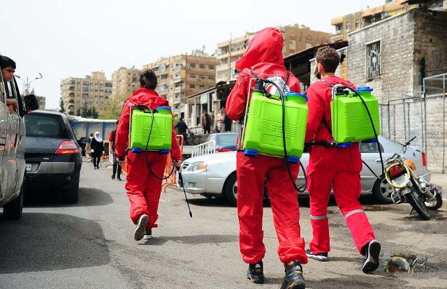 (200405) -- DAMASCUS, April 5, 2020 (Xinhua) -- Workers prepare to disinfect a public area in Damascus, capital of Syria, on April 5, 2020. Three new COVID-19 cases were reported in Syria on Sunday, bringing the total number of confirmed cases to 19, the Health Ministry said in a statement. (Photo by Ammar Safarjalani\/Xinhua