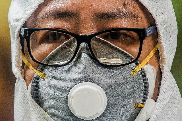 (200414) -- QUEZON CITY, April 14, 2020 (Xinhua) -- A health worker wearing a personal protective equipment is seen inside a COVID-19 mass testing center in Quezon City, the Philippines, on April 14, 2020. The Philippines reported on Tuesday 291 new confirmed COVID-19 cases, bringing the total number of infections in the country to 5,223. The Department of Health (DOH) also reported that 20 COVID-19 patients have died, bringing the death toll to 335. (Xinhua\/Rouelle Umali