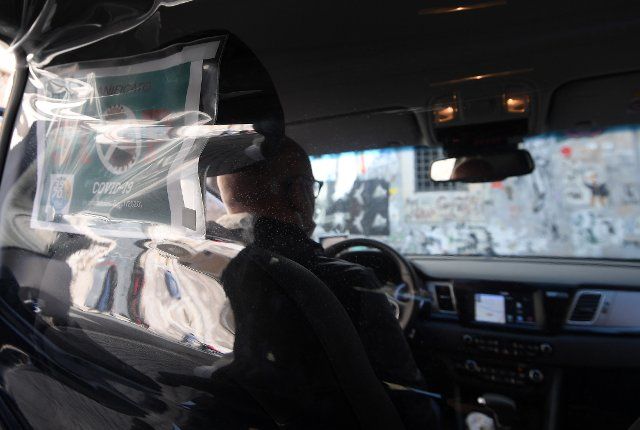 (200417) -- ROME, April 17, 2020 (Xinhua) -- Protective plastic barrier and a sanitation certification are seen in a taxi in Rome, Italy, April 16, 2020. The coronavirus pandemic has claimed 22,170 lives in locked-down Italy, bringing the total number of cases, including fatalities and recoveries, so far to 168,941, according to the latest data released by the country\