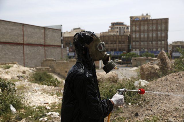 (200617) -- BEIJING, June 17, 2020 (Xinhua) -- A worker wearing protective equipment disinfects an area which is under lockdown as a precautionary measure to help fight the spread of COVID-19 in Sanaa, Yemen, June 16, 2020. (Photo by Mohammed Mohammed\/Xinhua