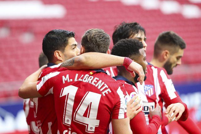 (201220) -- MADRID, Dec. 20, 2020 (Xinhua) -- Players of Atletico Madrid celebrate a goal during the Spanish La Liga league match between Atletico de Madrid and Elche CF in Madrid, Spain, Dec. 19, 2020. (Photo by Edward F. Peters\/Xinhua
