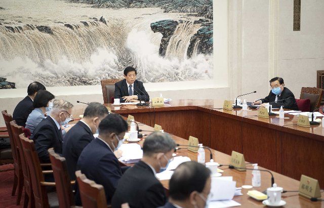 (201223) -- BEIJING, Dec. 23, 2020 (Xinhua) -- Li Zhanshu, chairman of the National People\