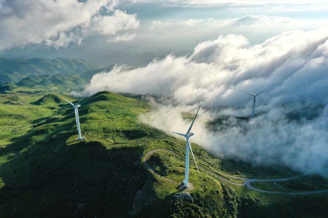 (210118) -- BEIJING, Jan. 18, 2021 (Xinhua) -- Aerial photo taken on Aug. 19, 2020 shows wind turbines in Jiucaiping scenic spot in southwest China\