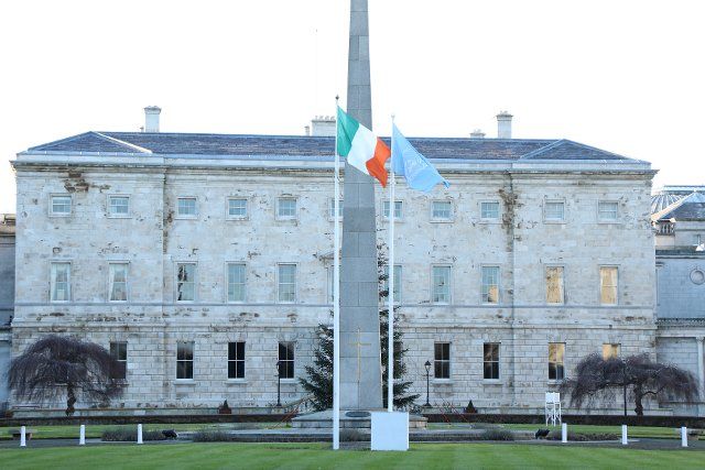 (210101) -- DUBLIN, Jan. 1, 2021 (Xinhua) -- The United Nations flag (R) is seen flying alongside the Irish national flag at Leinster House in Dublin, Ireland, Jan. 1, 2021. Ireland took up its seat as an elected member of the United Nations (UN) Security Council for a two-year term starting from Jan. 1, 2021, said the country\