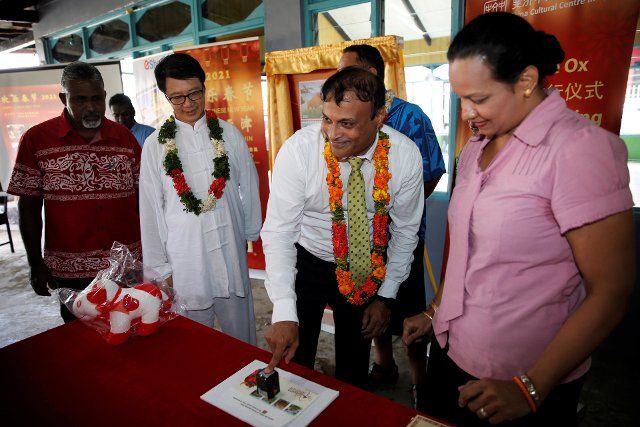 (210208) -- SUVA, Feb. 8, 2021 (Xinhua) -- Anirudha Bansod, CEO of Post Fiji, puts a postmark on the stamp and first-day cover launched in honor of the Year of the Ox at the Nausori Multicultural Center in Suva, Fiji, Feb. 8, 2021. The China Cultural Center in Fiji and Post Fiji jointly launched the Year of Ox stamps on Monday to celebrate the Chinese Lunar New Year which falls on Feb. 12 this year. TO GO WITH "Year of Ox stamps launched in Fiji" (Xinhua\/Zhang Yongxing