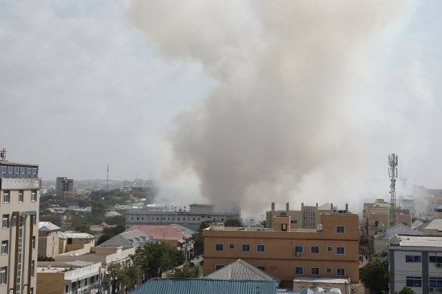 (210213) -- MOGADISHU, Feb. 13, 2021 (Xinhua) -- Smoke rises from the site of a blast in Mogadishu, capital of Somalia, Feb. 13, 2021. One person was killed and seven others injured when a suicide bomber drove a vehicle laden with explosives past a security checkpoint in Somalia capital, Mogadishu early Saturday, the police have confirmed. (Xinhua\/Hassan Bashi