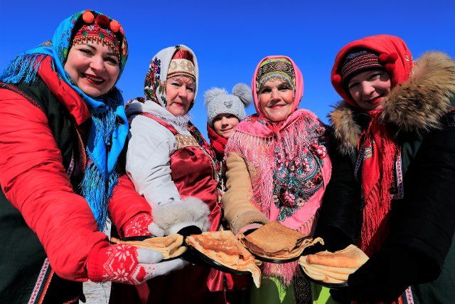 (210313) -- NUR-SULTAN, March 13, 2021 (Xinhua) -- People take part in the Maslenitsa festival celebrations in Nur-Sultan, Kazakhstan, March 13, 2021. Maslenitsa is a religious holiday to celebrate the beginning of spring, which lasts from March 8 to 14 this year. (Photo by Kalizhan Ospanov\/Xinhua