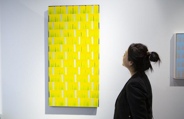 (210319) -- SYDNEY, March 19, 2021 (Xinhua) -- A woman visits a solo exhibition of art works at Vermillion Gallery in Sydney, Australia, on March 18, 2021. A new solo exhibition of works by Chinese artist Peng Yong went on display at the Vermillion Gallery in Sydney on Thursday, showcasing the artist\