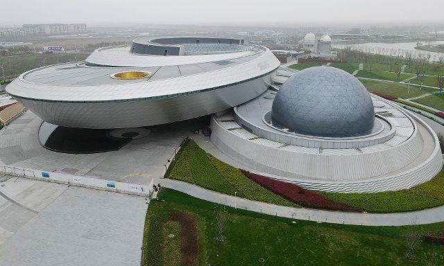 (210402) -- SHANGHAI, April 2, 2021 (Xinhua) -- Aerial photo taken on April 2, 2021 shows the main building of the Shanghai Planetarium in Pudong New Area, east China\