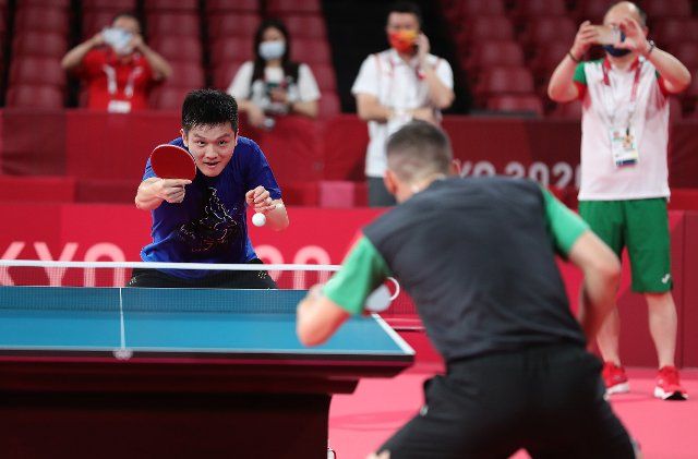 (210719) -- TOKYO, July 19, 2021 (Xinhua) -- Chinese table tennis player Fan Zhendong (L) attends a training session ahead of the Tokyo 2020 Olympic Games in Tokyo, Japan, July 19, 2021. (Xinhua\/Wang Dongzhen