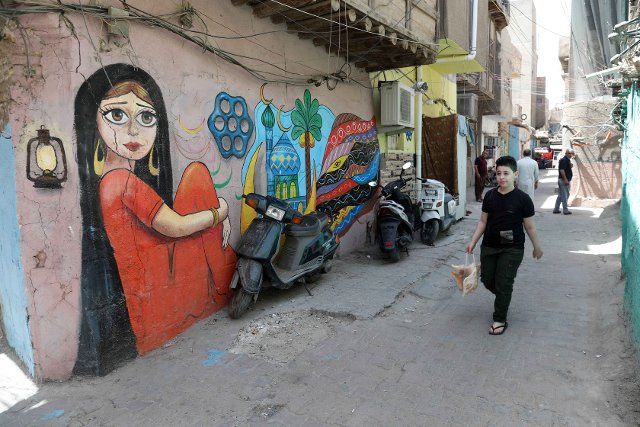 (210624) -- BAGHDAD, June 24, 2021 (Xinhua) -- Murals are seen in the old al-Anbariyen slum in Baghdad, Iraq, on June 2, 2021. TO GO WITH "Feature: Painters volunteer to breathe new life into old Baghdad neighborhood" (Xinhua\/Khalil Dawood