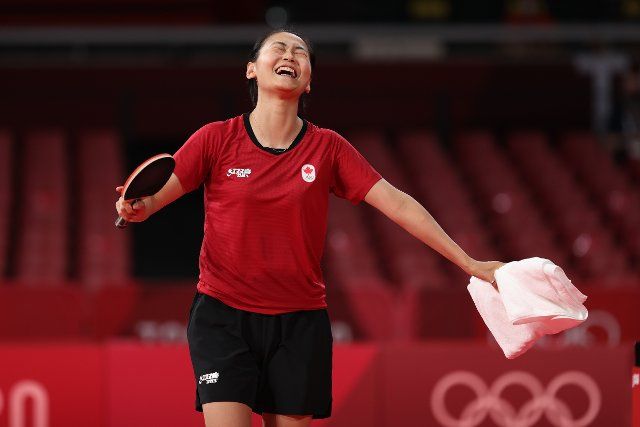 (210726) -- TOKYO, July 26, 2021 (Xinhua) -- Zhang Mo of Canada celebrates after the table tennis women\