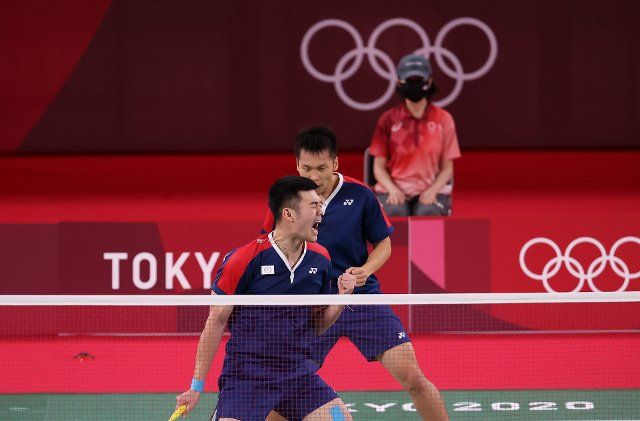(210730) -- TOKYO, July 30, 2021 (Xinhua) -- Lee Yang and Wang Chi Lin (Front) of Chinese Taipei celebrate during the men\