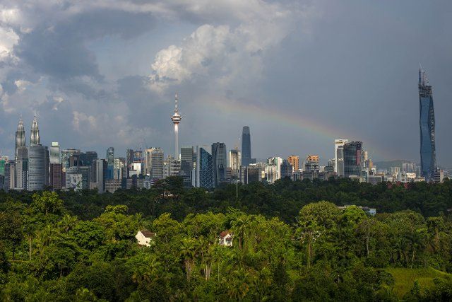 (210809) -- KUALA LUMPUR, Aug. 9, 2021 (Xinhua) -- A rainbow appears above the skyline of Kuala Lumpur, Malaysia, Aug. 9, 2021. (Photo by Chong Voon Chung\/Xinhua