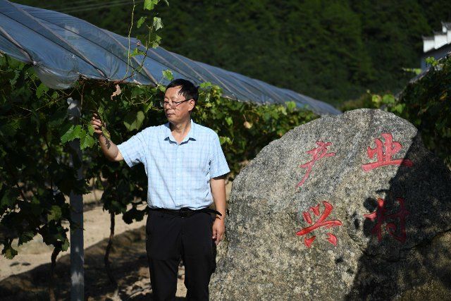 (211006) -- HEFEI, Oct. 6, 2021 (Xinhua) -- Li Xingguo, a senior geological engineer, visits an agricultural industry park in Henan Village of Wuhe Township, Yuexi County, in east China\
