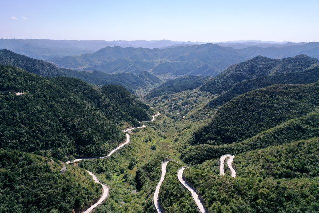 (210910) -- PINGSHUN, Sept. 10, 2021 (Xinhua) -- Aerial photo taken on Sept. 9, 2021 shows a mountain road popularly known as the "Taihang Sky Road" in Pingshun County, north China\