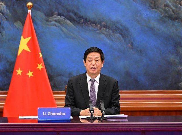 (211209) -- BEIJING, Dec. 9, 2021 (Xinhua) -- Li Zhanshu, chairman of the National People\