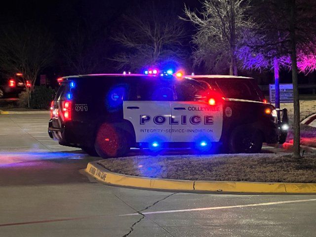 (220116) -- HOUSTON, Jan. 16, 2022 (Xinhua) -- A police car is seen blocking the road to the Congregation Beth Israel in Colleyville, a suburban city of Fort Worth in Texas, the United States, Jan. 15, 2022. All hostages "are out alive and safe" after an hours-long standoff ended on Saturday night at a synagogue in Colleyville, south central U.S. state Texas, Governor Greg Abbott tweeted. Colleyville police confirmed the information just before 10 p.m. local time (0400 GMT on Sunday). The suspected hostage taker is dead, according to Colleyville Police. Multiple media outlets reported that the suspect claimed to have set bombs in several locations inside the synagogue. (Photo by Dan Tian\/Xinhua